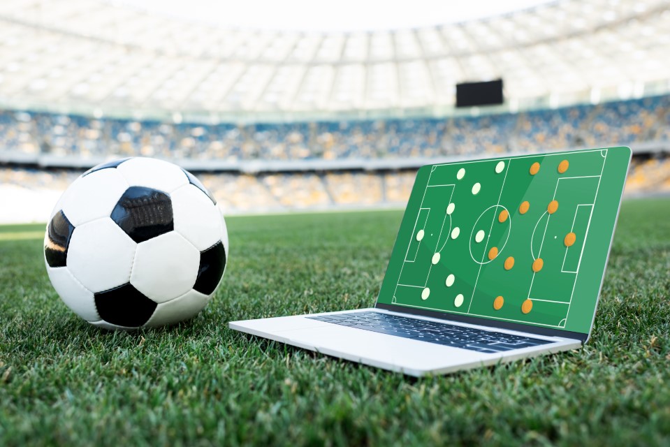 soccer-ball-and-laptop-with-formation-on-screen-online-live-bet-betting-football-malaysia-singapore